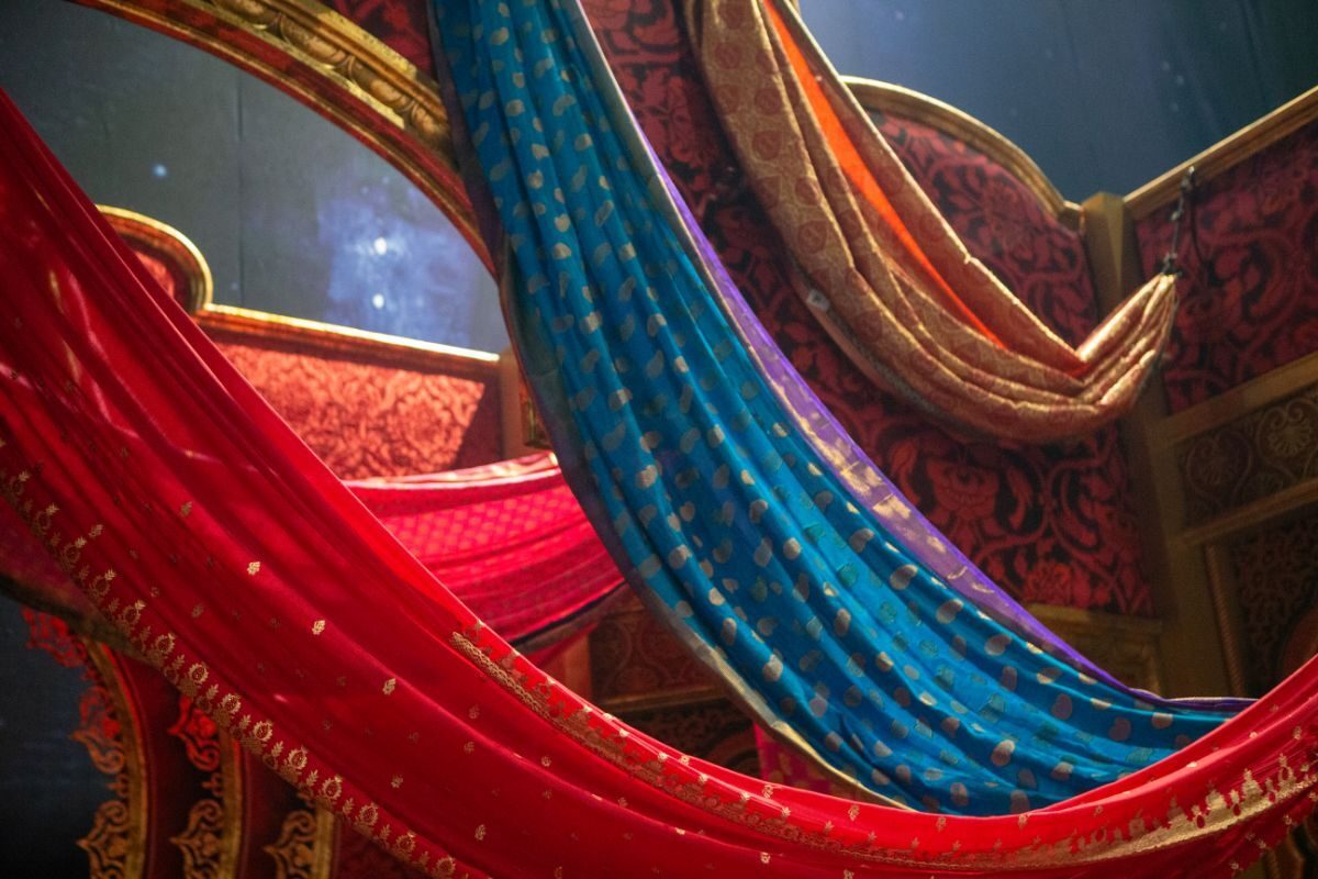 Red, blue and gold silk drapes with metallic detailing made by Reveal Productions for Moulin Rouge! The Musical