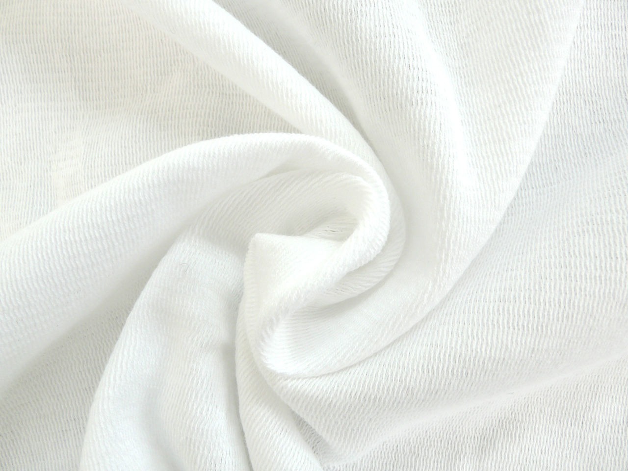 White cyclorama cloth gathered in soft folds, photographed in true colour